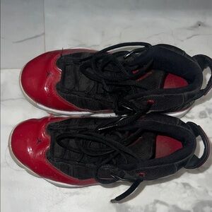 Kids Red and Black Nike Jordan’s basketball shoes